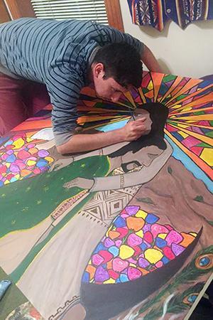 Photo of Andrés Arteaga painting