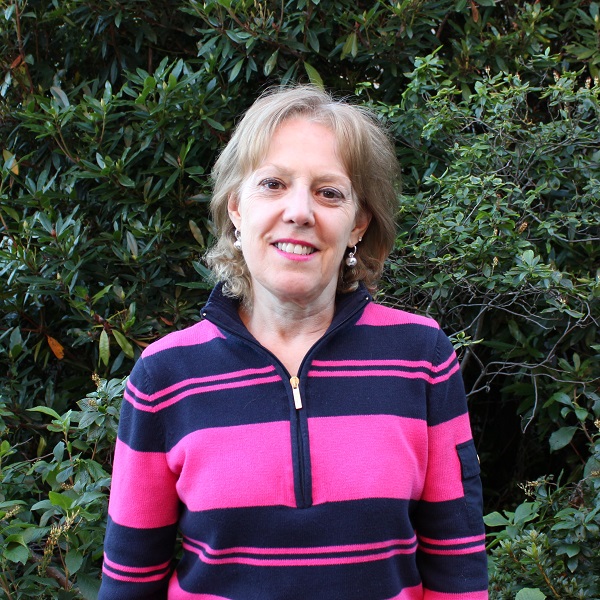 Photo of June Johnson in front of trees