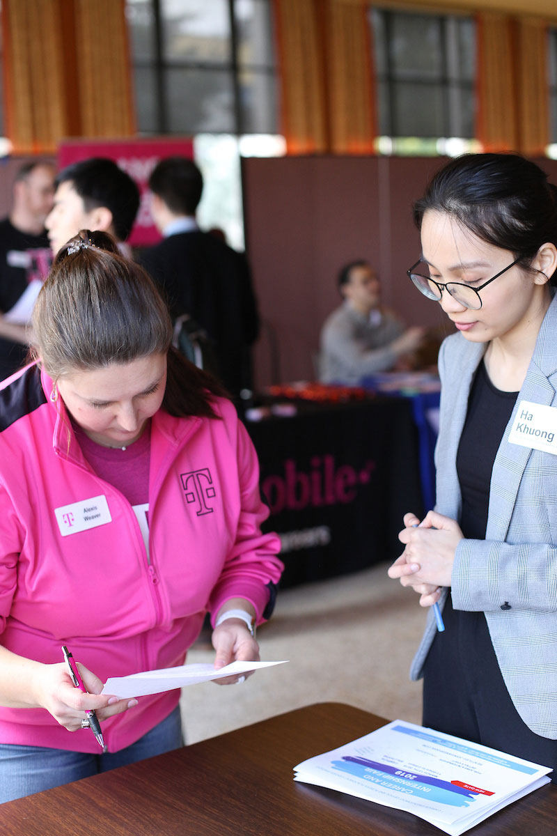 Student and recruiter at the Career and Internship Fair