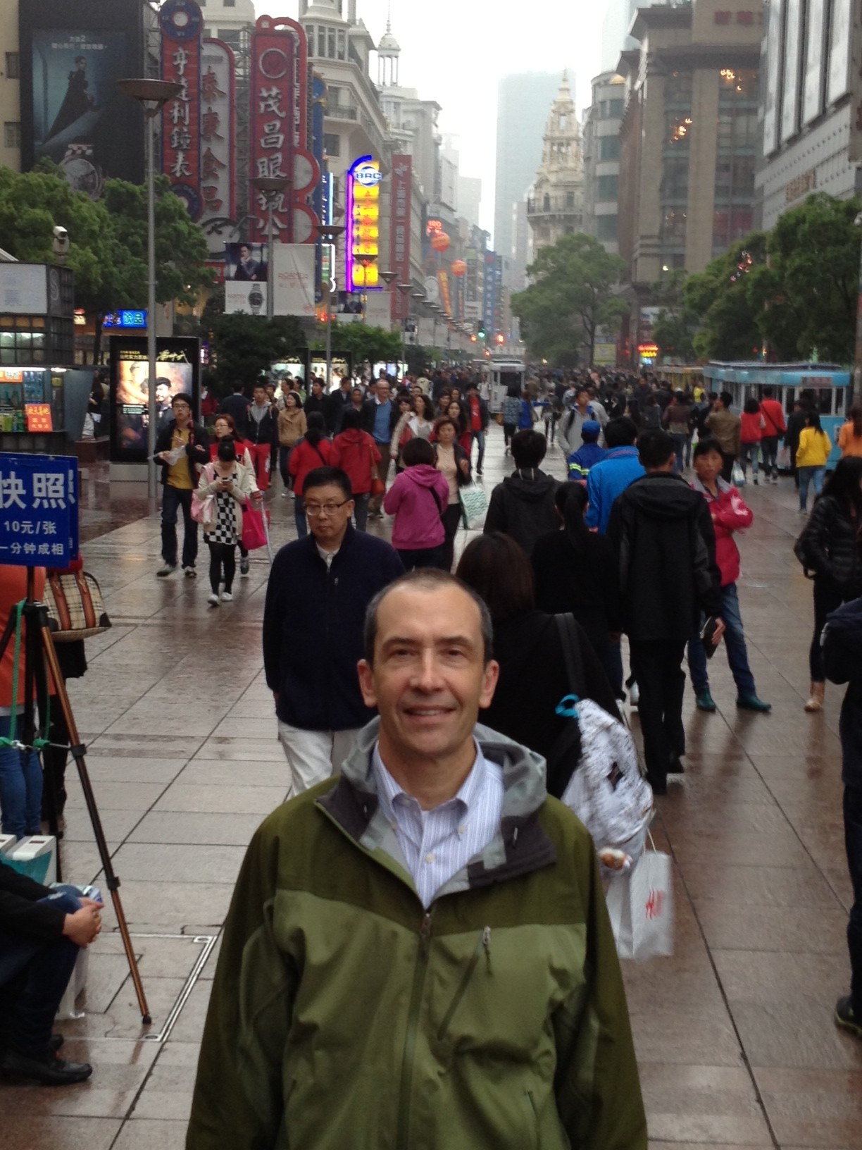 Person standing in a busy road in Nanking