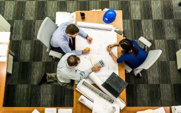 Three people meeting from a birds-eye view