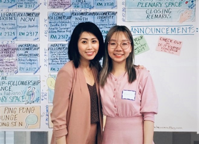 Professor and student pose for a photo