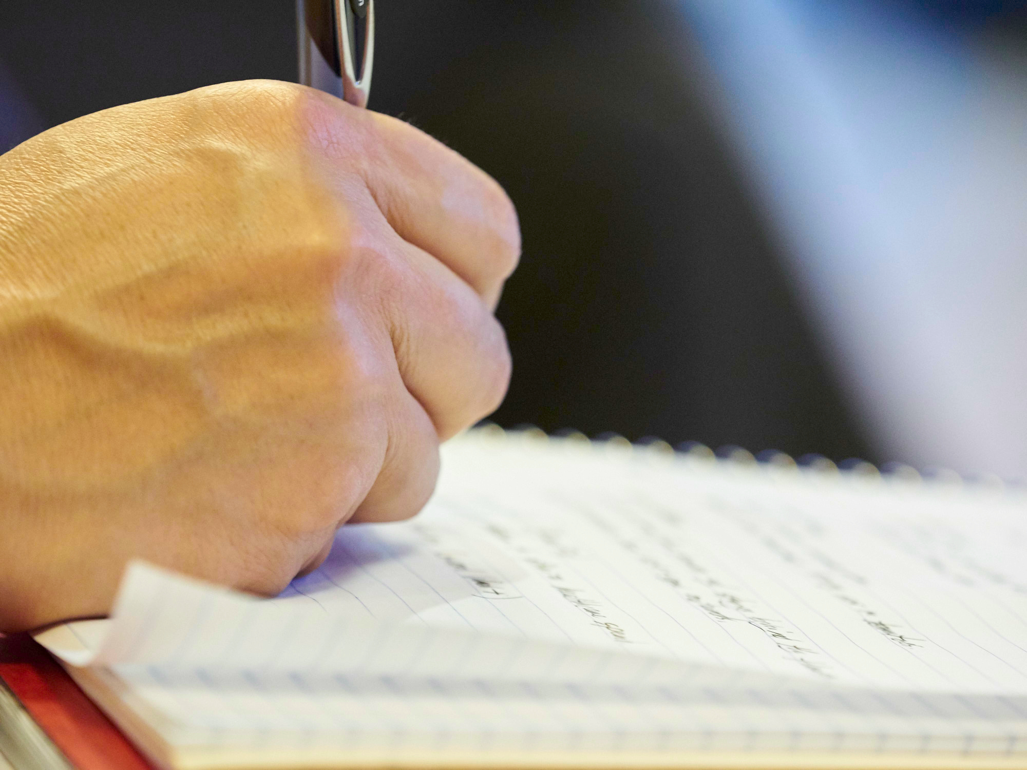 Hand writing on a notebook