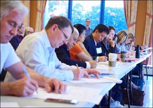 Judges at a table writing