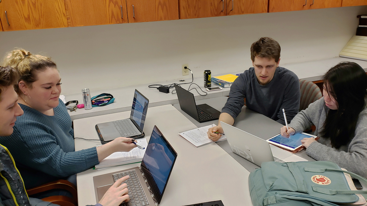 Accounting students meeting with tutors in the tutoring lab.