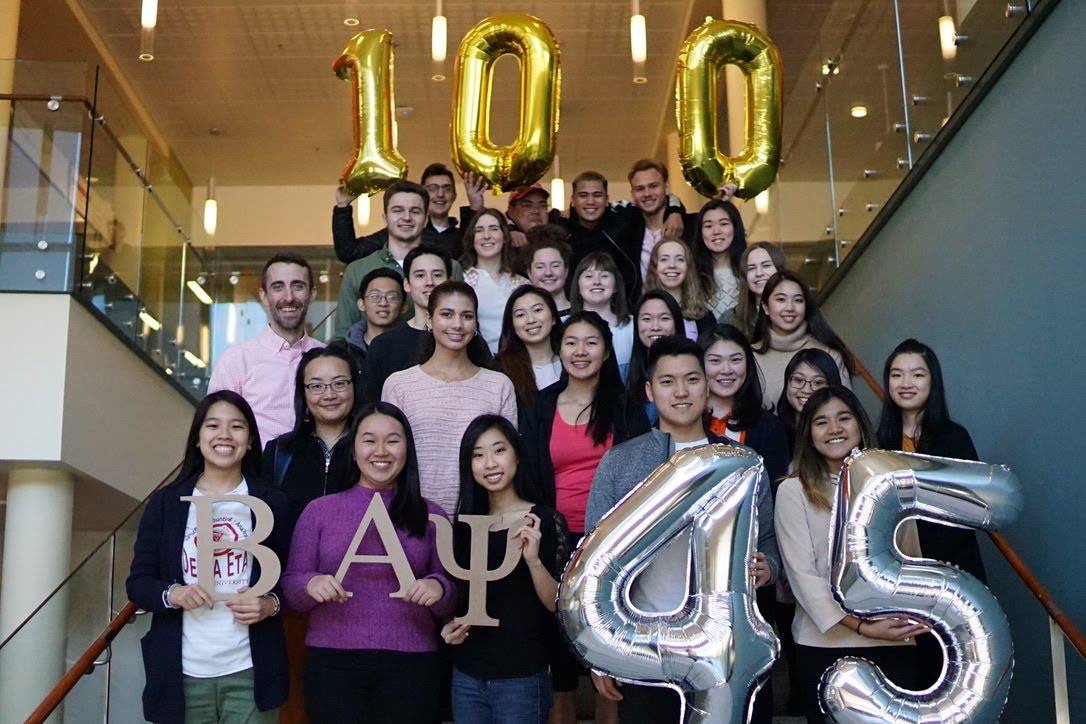 Beta Alpha Psi students celebrating 100 years since the founding of Beta Alpha Psi and 45 years since founding of the Delta Eta chapter.