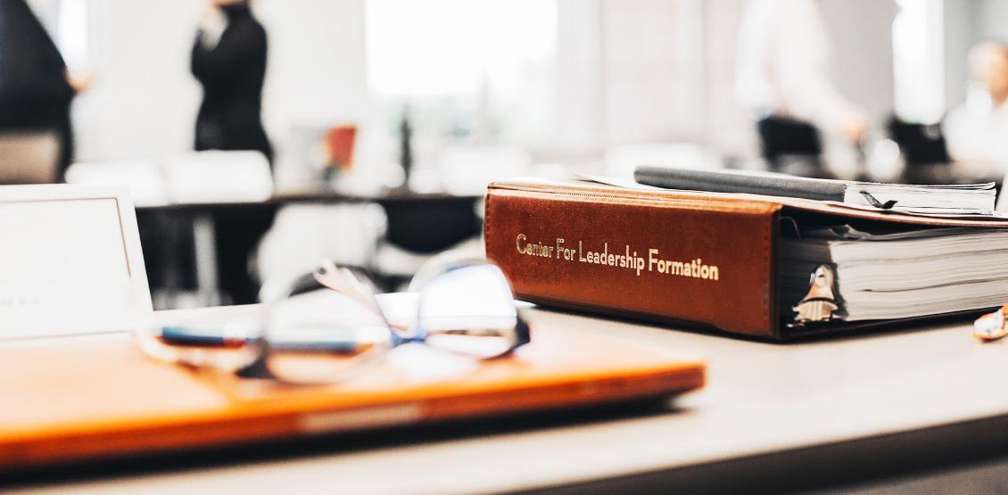 Center for Leadership Formation binder on a table