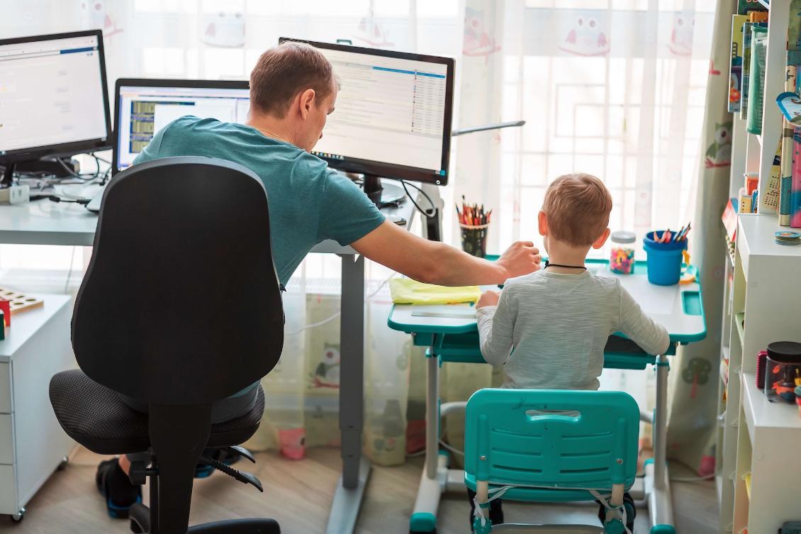 Father and son working from home