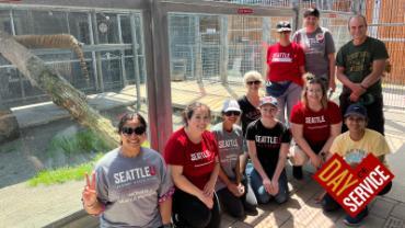 People posing for the photo at the Cougar Mountain Zoo for the Day of Service