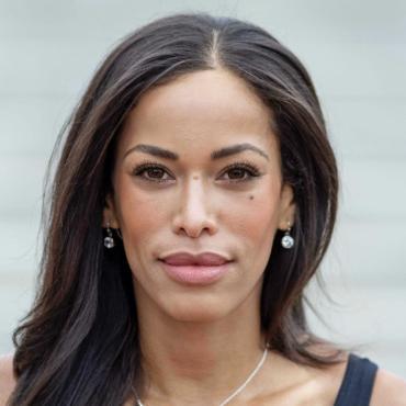 A profile photo of Tiffany Harris, '08 standing in front of water