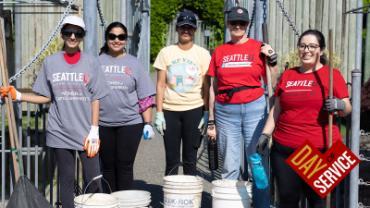 5 people standing in the photo for the Day of service