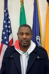 man in front of flags