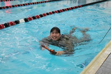 cadet in pool with rubber ducky