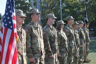 US flag and contracting cadets