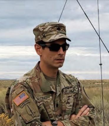 Officer in field arms crossed