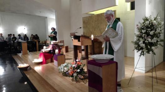 Two presiders praying at Chapel service