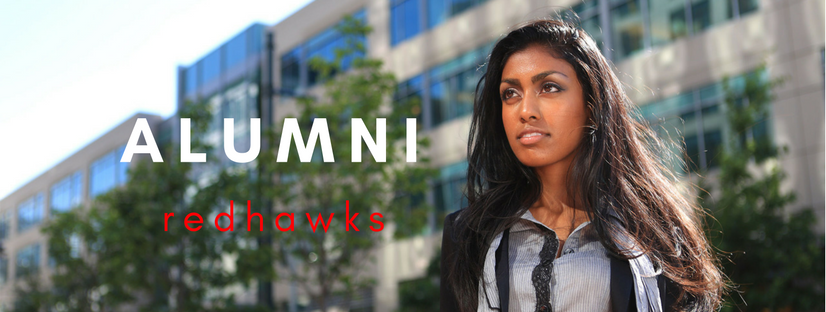 Professional woman standing in front of office building