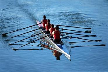 Crew team rowing