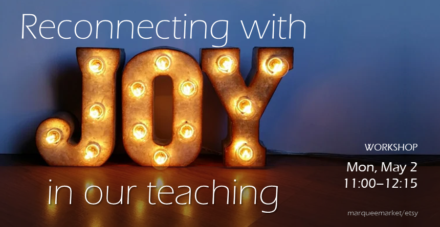 An image of the word JOY illuminated with lightbulbs