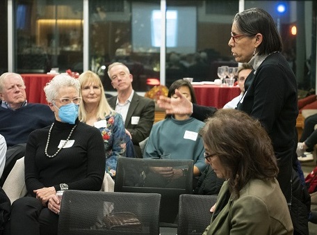 Professor Marissa Olivares speaks with the audience at an event