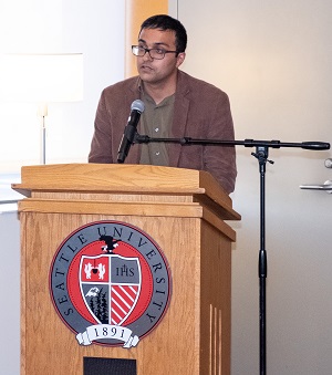 Raman Khanna, alum and staff member for Congresswoman Pramila Jayapal at podium