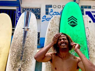 Happy man with surfboards