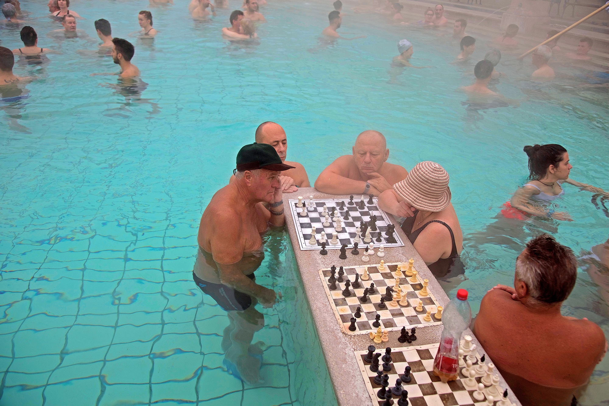 People playing chess in swimming pool