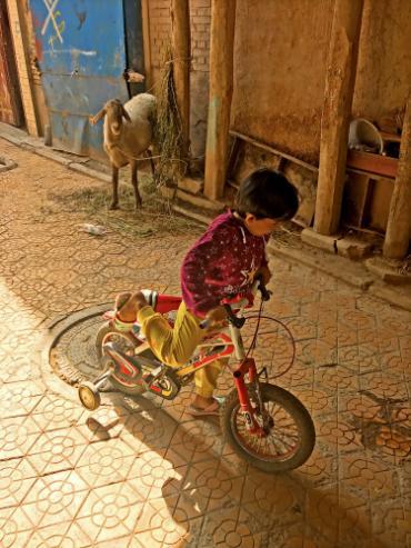 Child riding a bike in China