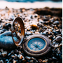 Compass on a rocky beach