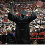 Graduate celebrates with crowd at commencement