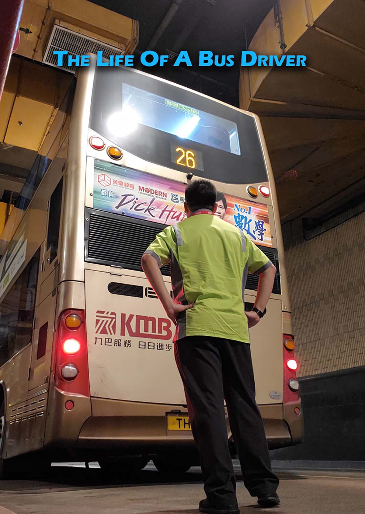 a person stand sin front of a double decker bus