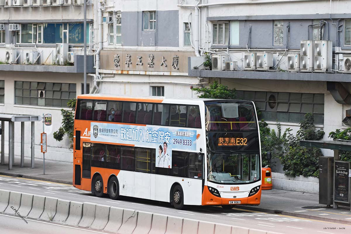 a double decker bus in from of highrise buildings in a city