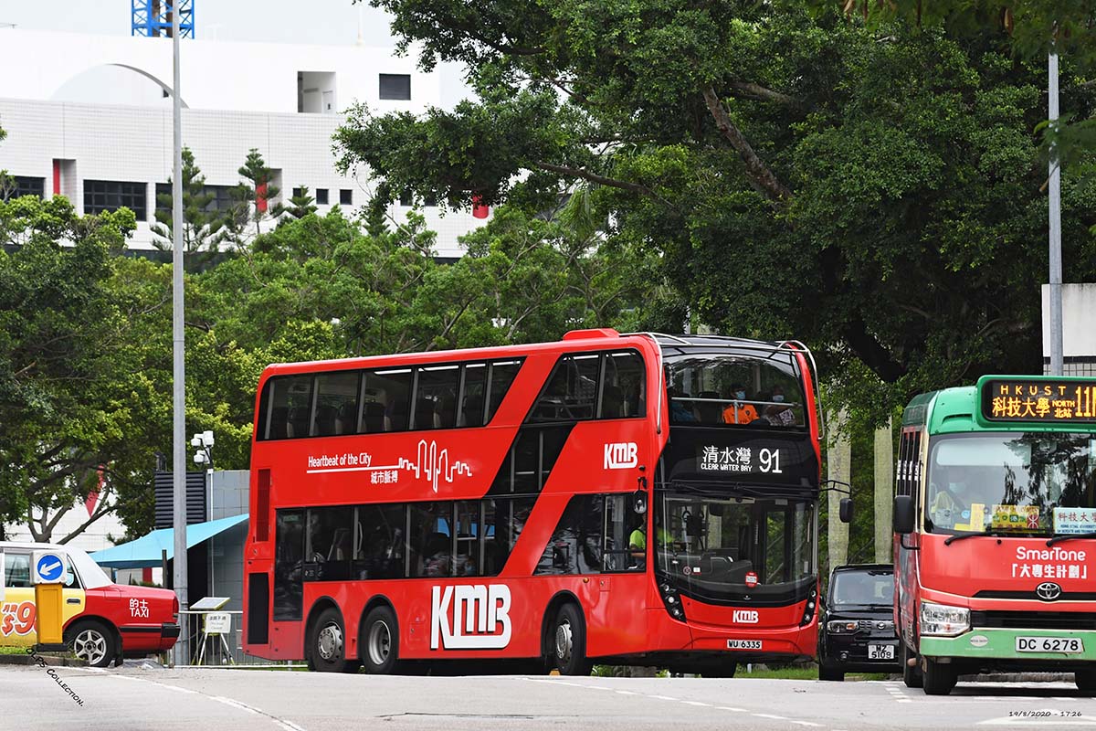 photograph of a double decker bus on a tree lined street