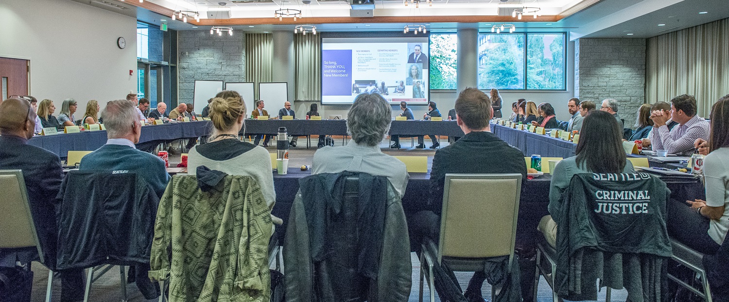 Member of the SU Criminal Justice Advisory Committee around a large table