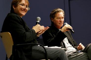 Dr. Kirsten Thompson interviews esteemed actor Val Kilmer at a campus Q&A event.