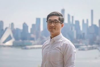 Image of Dr. Chengxin Xu in front of Seattle skyline