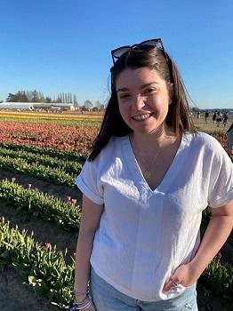 Image of Clare Rogers in field of flowers