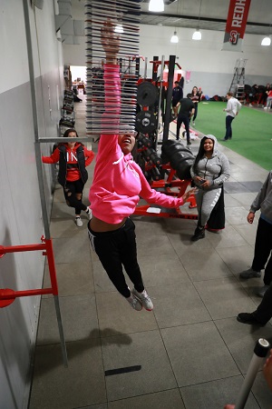 High school student jumps during demonstration at 2019 Kinesiology Biomechanics Fair