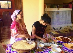 Two people cooking food in Morocco