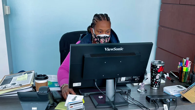 Social worker working at a computer desk