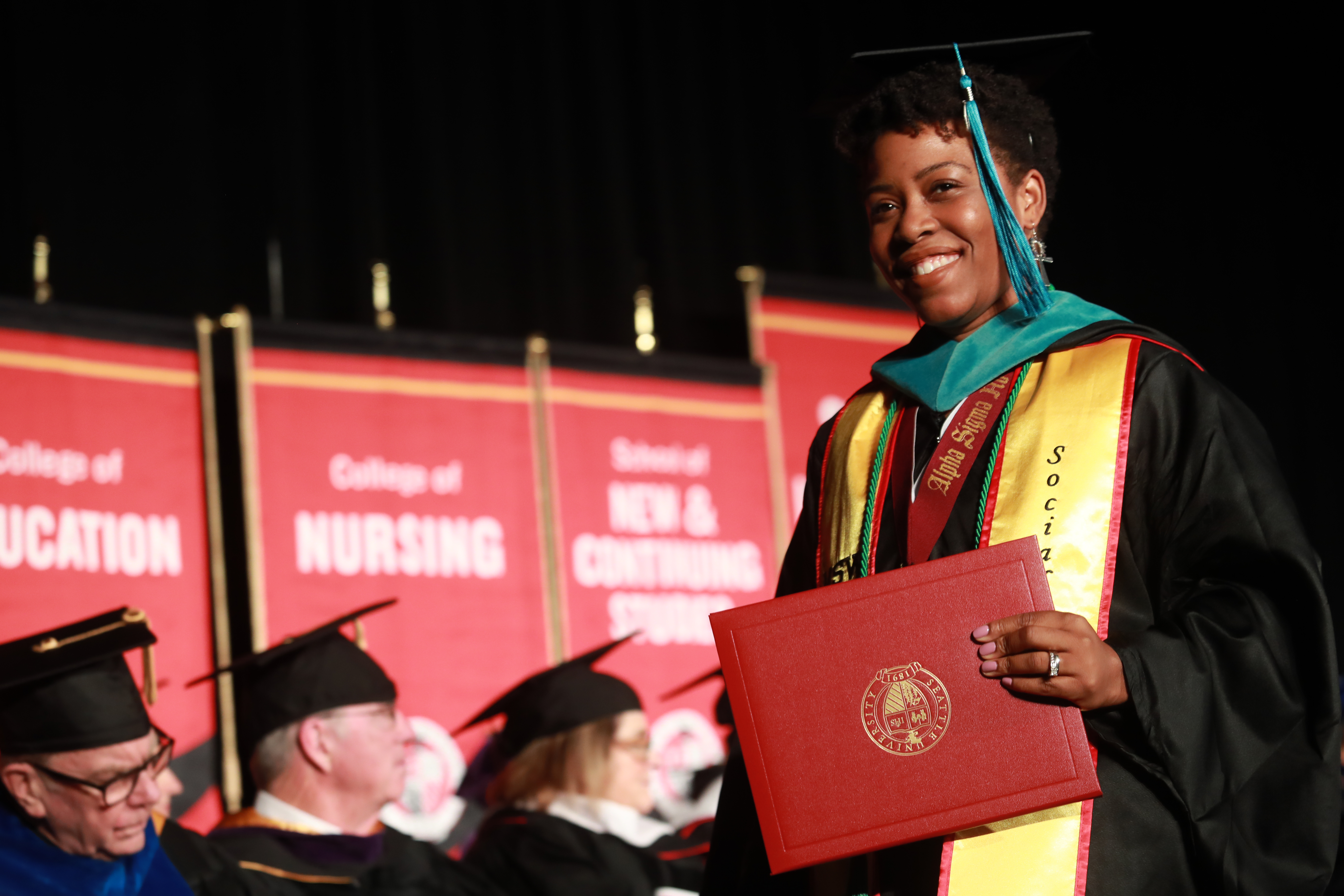 Graduating student walking across stage