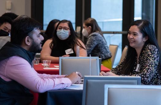 Alumnus and students in conversation