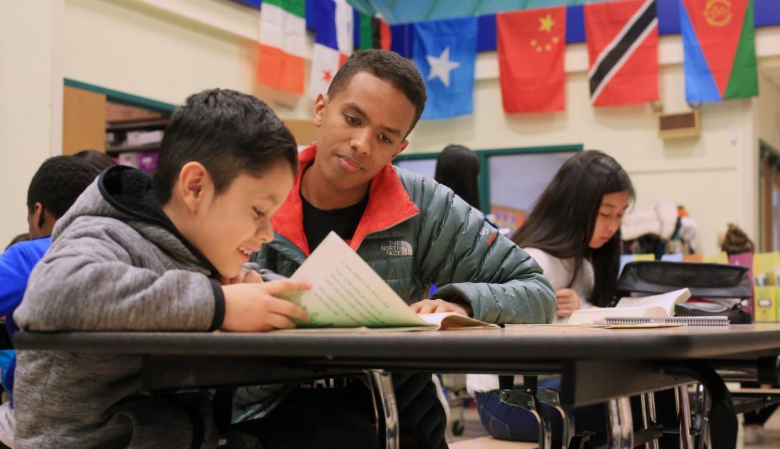 Image of SU turor workingn with Bailey Gatzert Elementary student