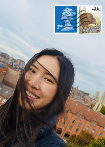 Woman smiling at the camera with windswept hair