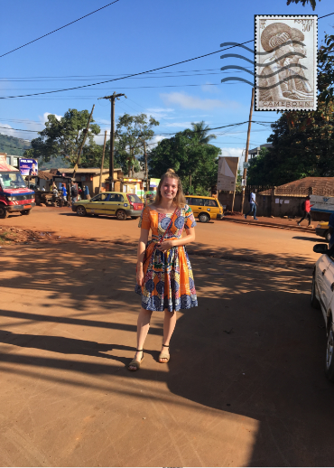 Woman smiling at the camera on a street in Cameroon