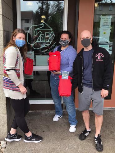 Sarah Dean and Brad Fifield posing with medical kits.