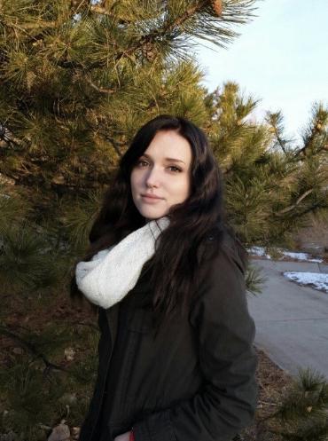 Lorraine standing on campus