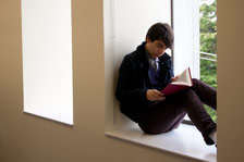 Guy sitting at window