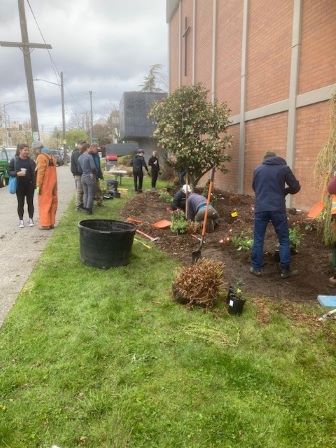 Students rennovating hawk grounds.