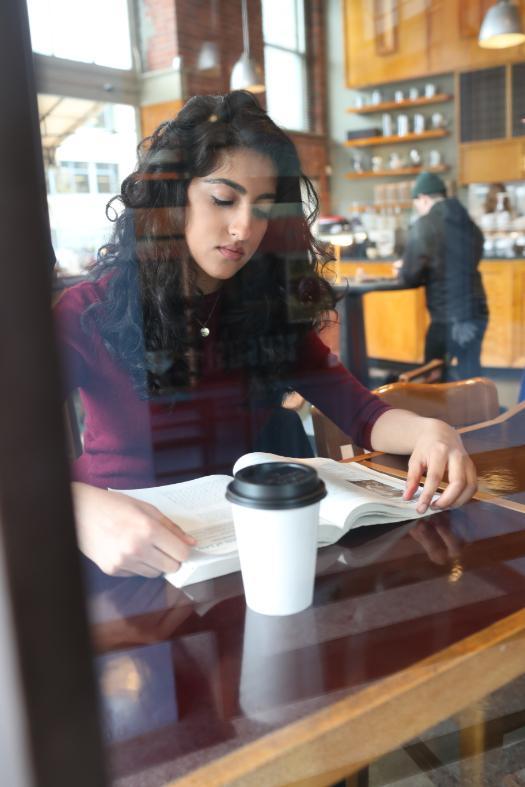 Student Reading at Coffee Shop